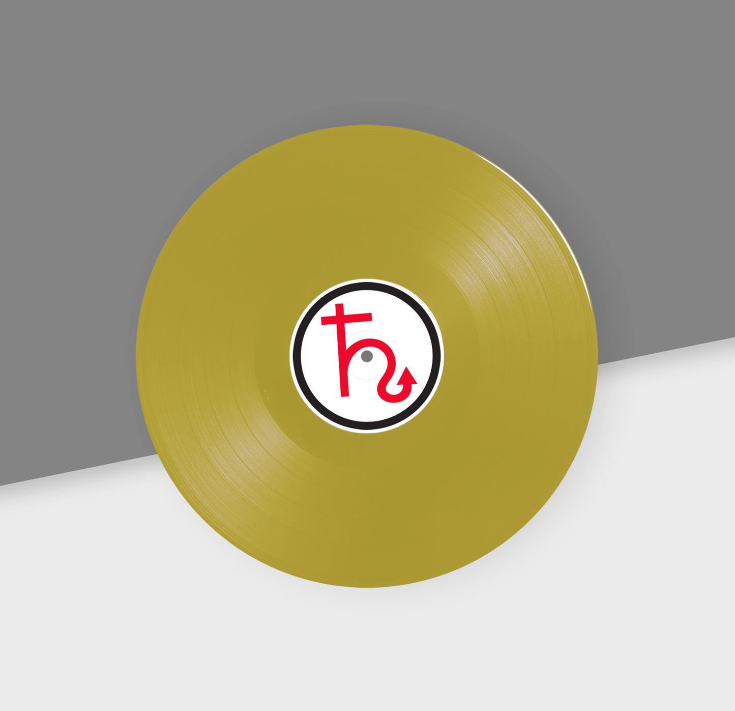 A metallic gold 12-inch vinyl record with a red and black label in the center, placed on a grey and white background.