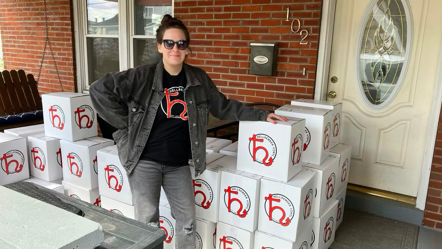 Hellbender Vinyl project manager Pam poses with a delivery of records at a customer's house in Western Pennsylvania, just outside Pittsburgh