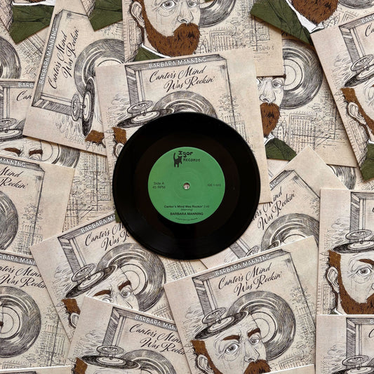 Vinyl record with a green label on top of vintage-style advertisements featuring illustrated faces.