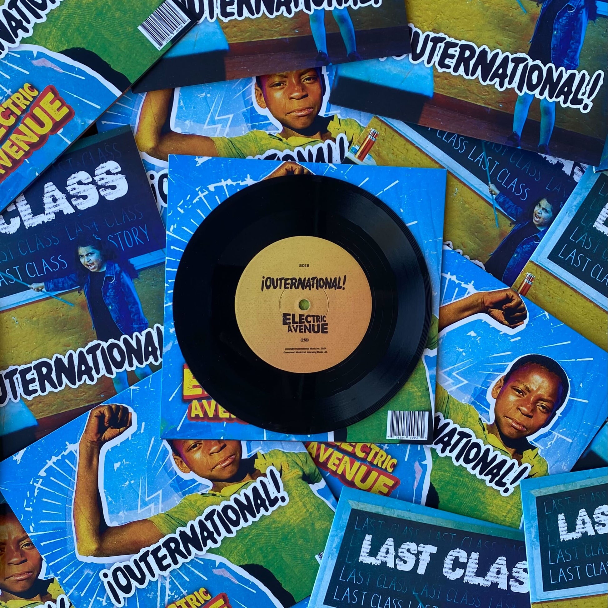 Vinyl record with a cover featuring a child and text on a background of similar covers.