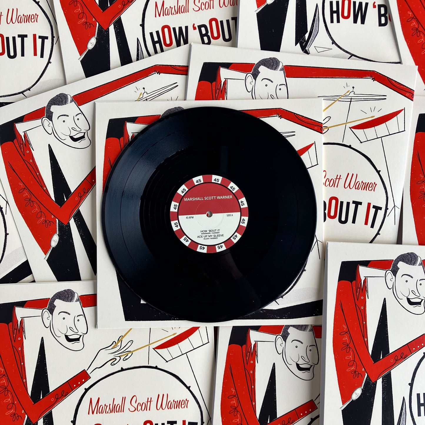Vinyl record with a red label on a background of album covers featuring a caricatured man.