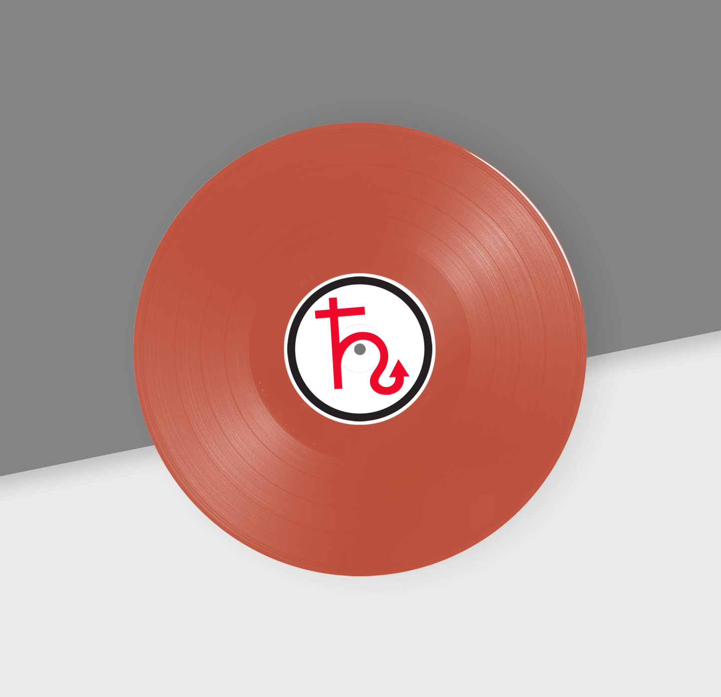 Maroon vinyl record with a logo on a gray and white background
