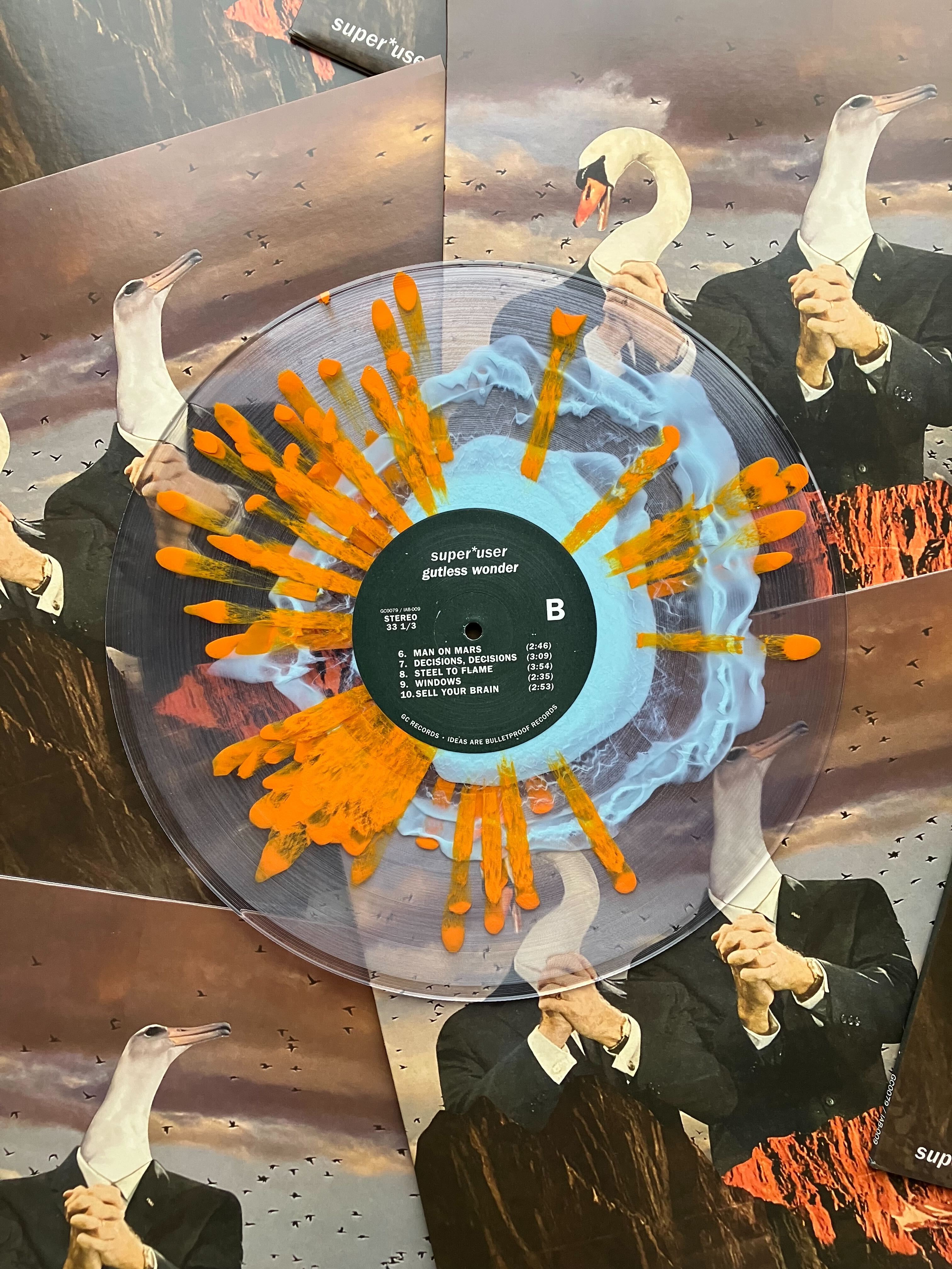 Vinyl record with orange and blue blog and splatter design.